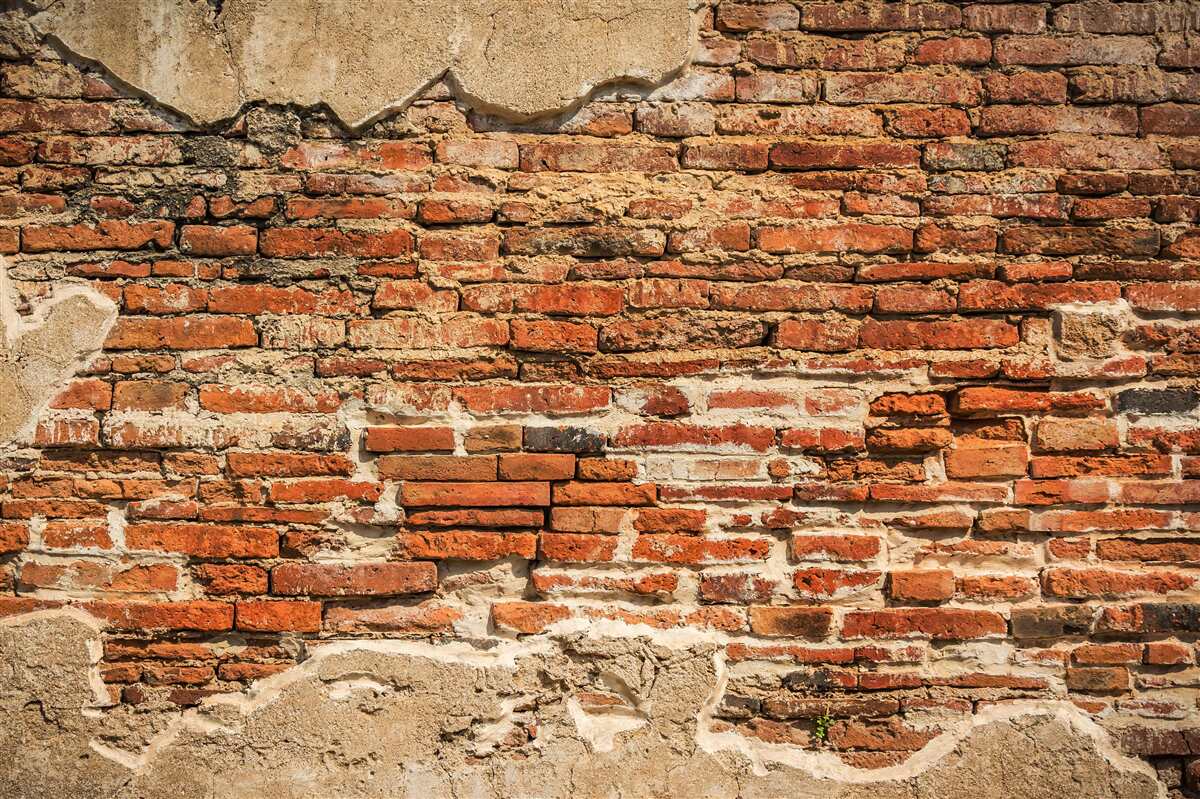 Fototapeta mur ceglany, który stał się bardzo zniszczony