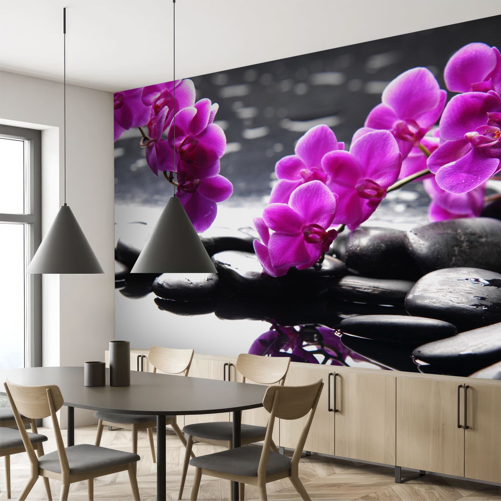 Fototapeta orchidea o liliowym odcieniu, osadzona na matowych czarnych kamieniach