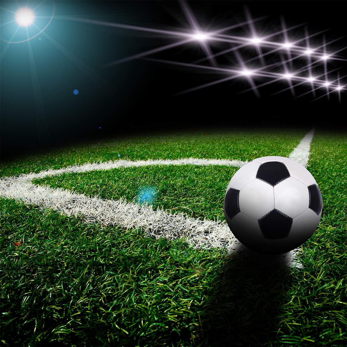 Fototapeta piłka leży na trawniku stadionu